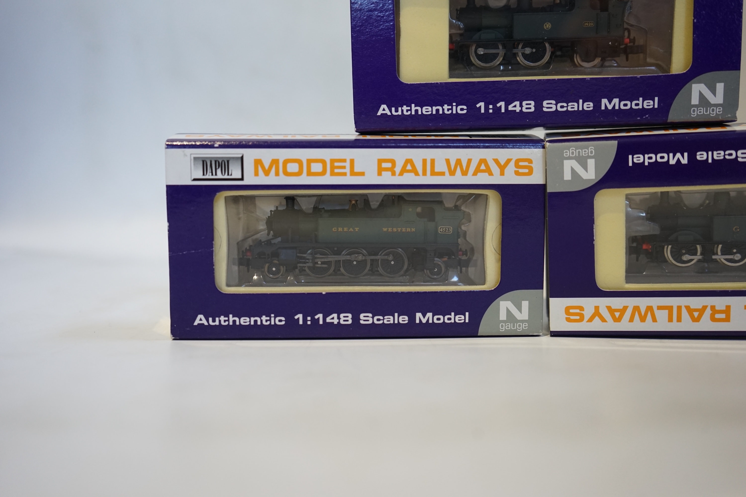 Three boxed Dapol N gauge railway GWR tank locomotives; a Class 45xx, 4523 (ND-014), a Class 14xx, 1420 (ND004), and a Class 14xx, 1425 (ND001). Condition - good.